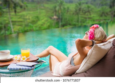 Woman Relaxing In Tropical Villa