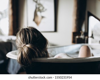 Woman Relaxing Whilst Taking A Bath At A Luxury Vintage Spa; Vintage Bathtub Sensual Bubblebath 