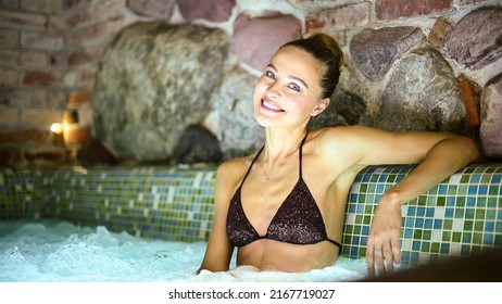 Woman Relaxing In A Whirlpool Bath Tube