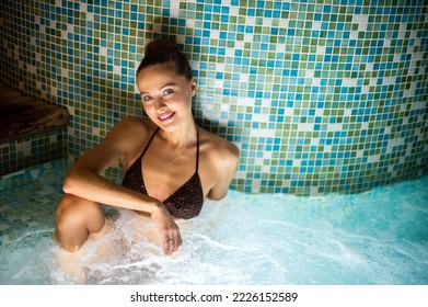 Woman Relaxing In A Whirlpool Bath Tube