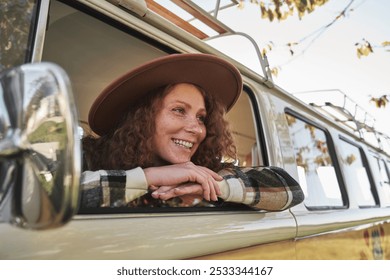  Woman Relaxing at Window of Vintage Van in Nature - Powered by Shutterstock