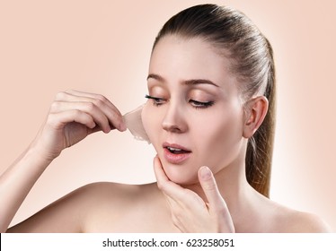 Woman Remove Her Old Dry Skin From Face.