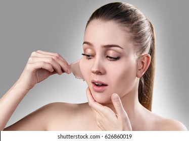 Woman Remove Her Old Dry Skin From Face.