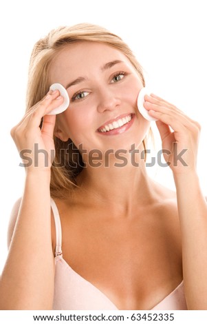 Woman removing makeup with cleansing pads
