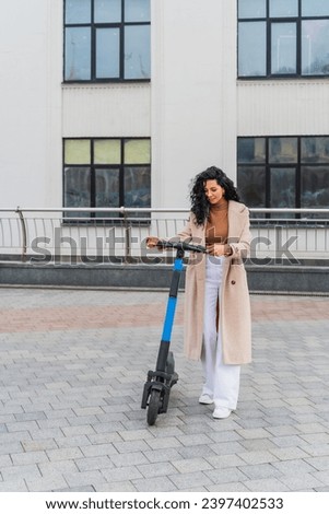 Woman renting an electric scooter on the street