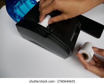 Woman Replacing Thermal Paper Rolls In POS Receipt Printer, Isolated On White Background.