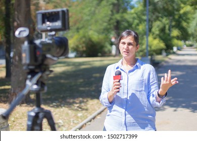 Woman Reporter Reporting From Field