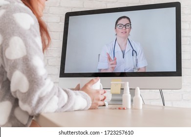 A Woman With A Respiratory Illness Is Quarantined And Is Talking To A GP On A Webcam. A Doctor For An Online Consultation For A Sick Patient.