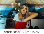 
Woman in a Restaurant Checking her Wallet for Tip Cash. Worried customer not having enough money due to inflation
