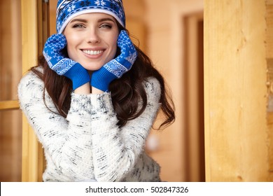 Woman Resting After A Winter Sports On The Terrace Of The House