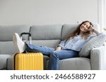 Woman resting in the living room of her house until it