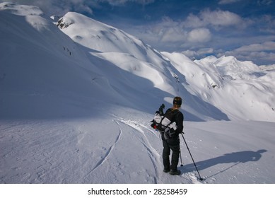 Woman resting in snow covered mountains