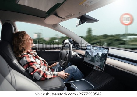 Woman resting while her car is driven by an autopilot. Self driving vehicle concept