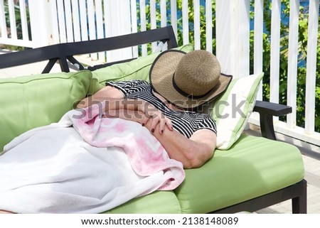 Similar – Young woman relaxing in a hammok