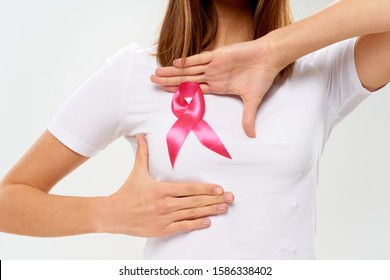 woman with ribbon charity foundation health care care - Shutterstock ID 1586338402