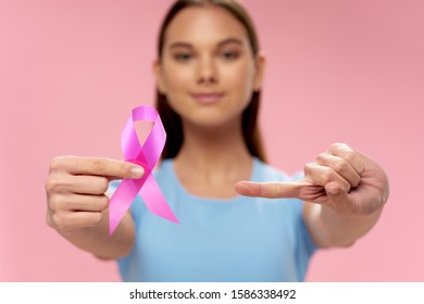 woman with ribbon charity foundation health care care - Shutterstock ID 1586338492