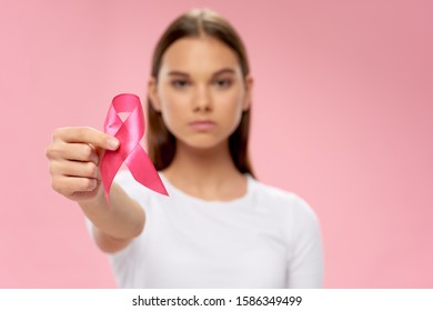woman with ribbon charity foundation health care care - Shutterstock ID 1586349499