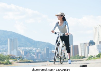 Woman Riding A Bicycle