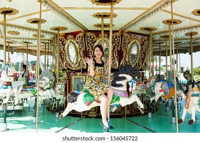 Woman Riding Fun Merry Go Round