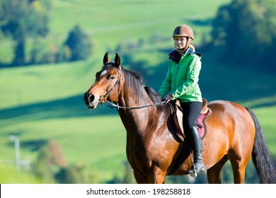 Woman Riding A Horse