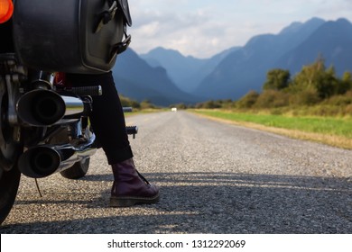 Woman Riding A Motorcycle On A Scenic Road Surrounded By Canadian Mountains. Taken In Pitt Meadows, Greater Vancouver, BC, Canada.