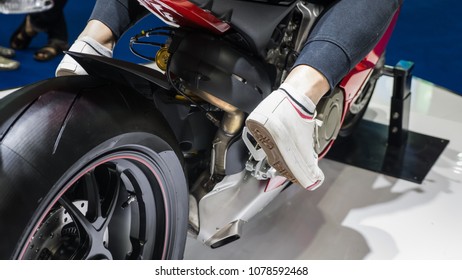 Woman riding motorcycle.Sitting on a motorbike. - Shutterstock ID 1078592468