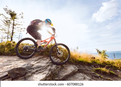 Woman Riding Mountain Bike Downhill