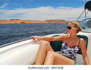 A Woman Riding On A Boat At Lake Powell