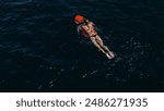 Woman riding a sea bob in the sea, woman enjoying riding an underwater tug in the sea