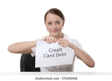 Woman Ripping Up Sign With The Word Credit Card Debt Written On It Looking Happy And Joyful