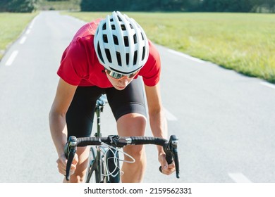 Woman Road Cycling On Race Bike Outdoor In Nature