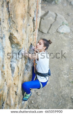 Similar – Little boy looking through the wall of a castle