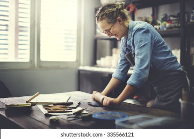 Woman Rolling Clay Craftsman Skill Concept