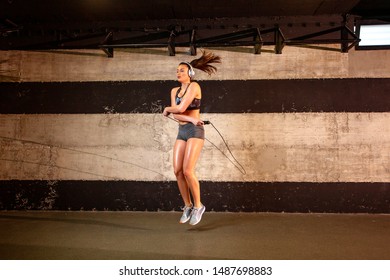 Woman With Rope Jump In Gym