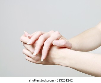 Woman Rubbing Cream In Hands