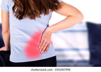 Woman Rubbing Her Back Pain