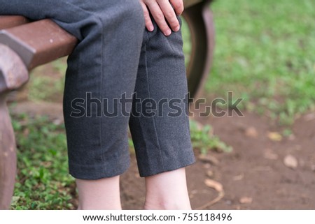
Woman rubbing her feet