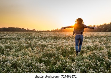 Woman run on golden field - Indian summer sunlight - Shutterstock ID 727496371