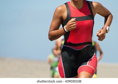 Woman Runner Running On Triathlon Race On Sunny Days