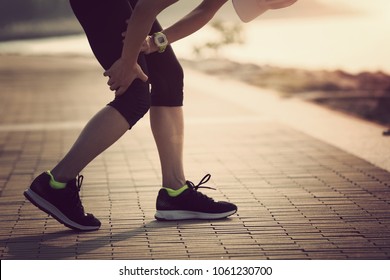 Woman Runner With Sports Running Knee Injury 