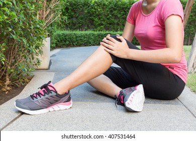 Woman Runner Touch Her Injured Knee