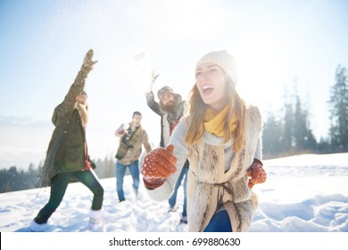 Woman Running Away From The Snow Fight