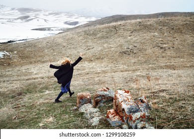 Woman Running Away In The Snow Landscape