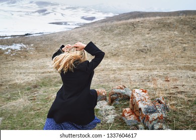 Woman Running Away In The Winter Landscape