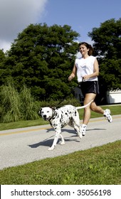 Woman Running With Dog