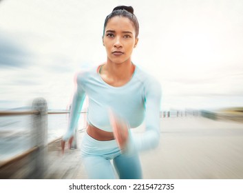 Woman, Running And Exercise Motion Blur By Ocean, Sea Or Promenade For Health, Fitness And Wellness. Sports, Runner And Female From India Out For Run, Training Or Cardio Workout Outdoors By Seashore