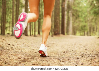 Woman running in the forest 
