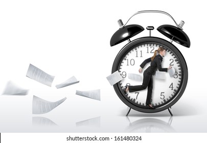 Woman running in a giant clock, concept