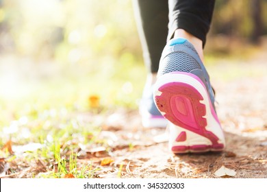 Woman Running Legs In Sunset Forest