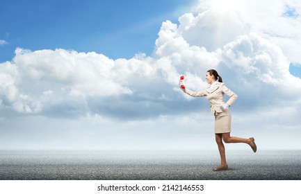 Woman Running Outdoor With Vintage Red Phone. Call Center Operator In White Business Suit With Telephone On Road. Hotline Telemarketing And Communication. Professional Business Assistance And Support